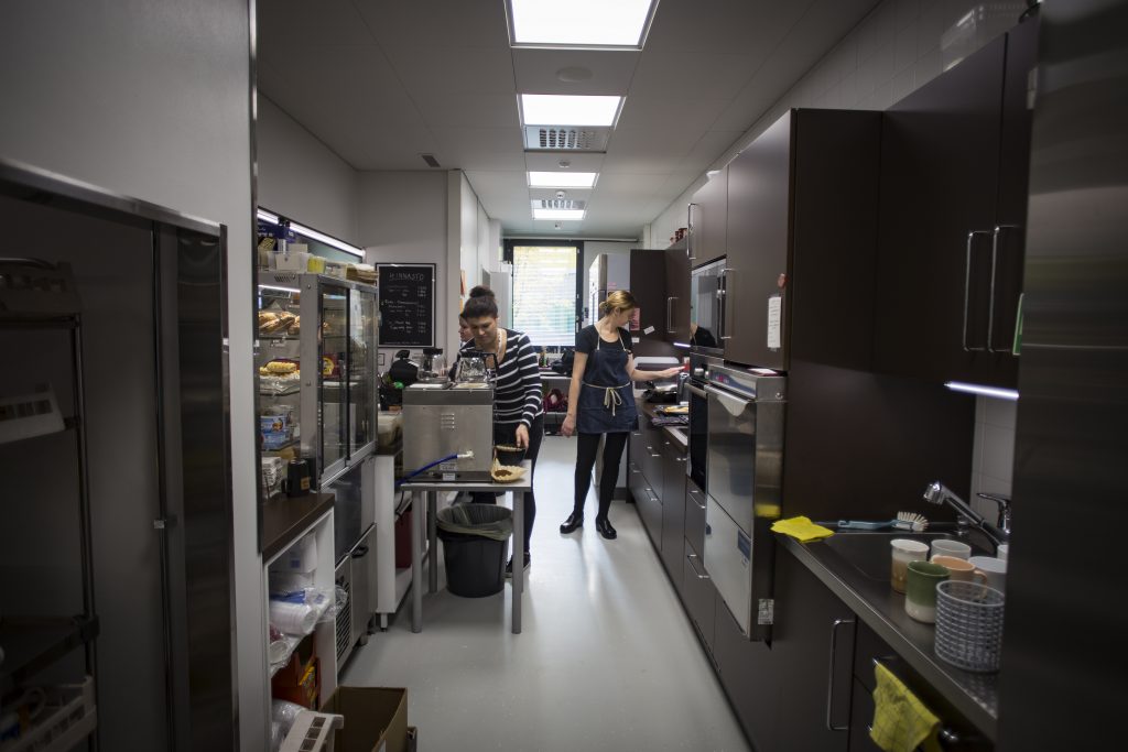 The staff members find the new kitchen facilities good: spacious enough for a couple of workers to move around and enough storage space. The facilities get minor complaints for their floor: it must be constantly mopped since dirt shows instantly. Pictured on the left is Heidi Halkola, on right Anne Pakari.