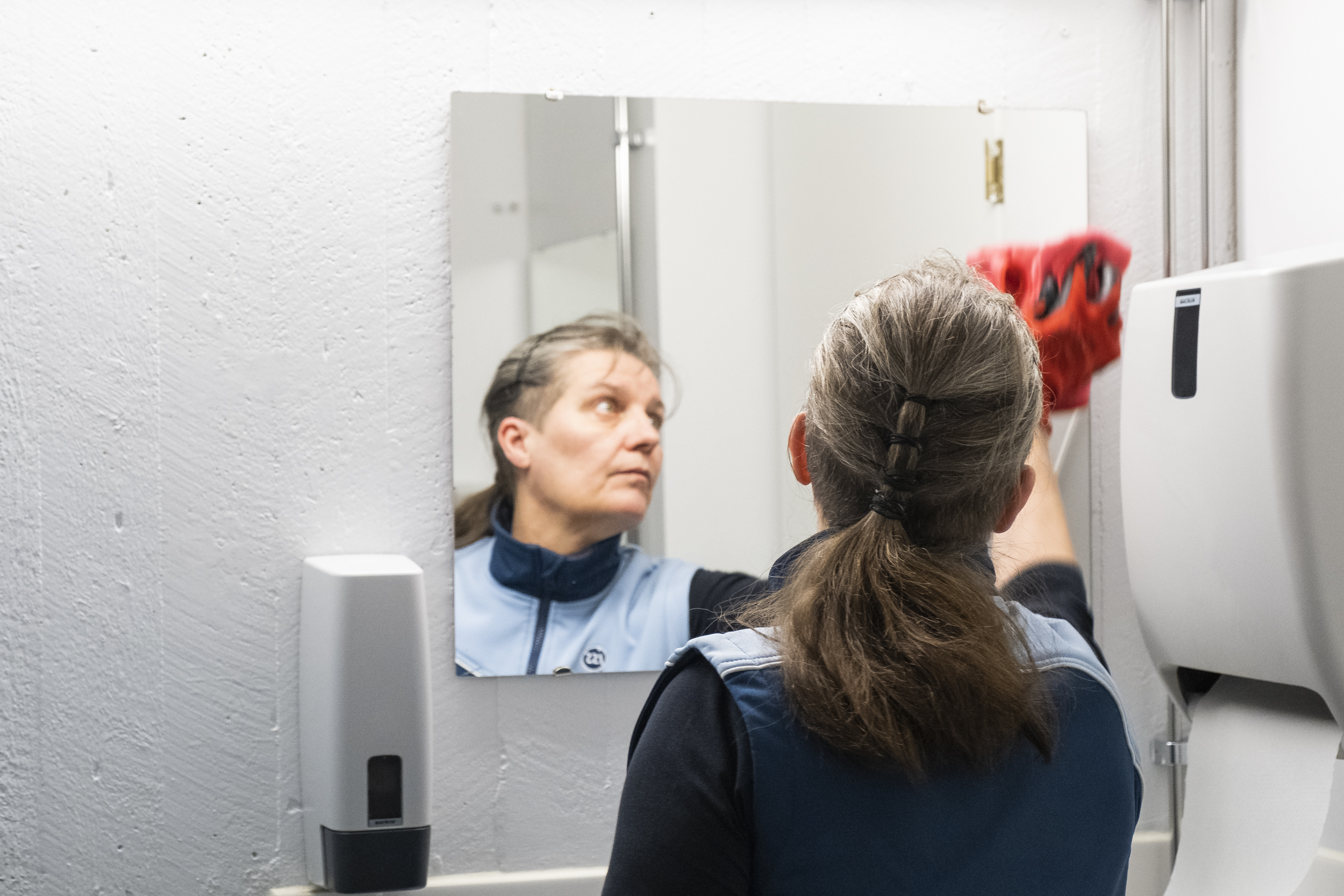 Shot for Oulun Ylioppilaslehti in January 2020. Pictured is a a clening lady in the campus bathroom of University of Oulu.