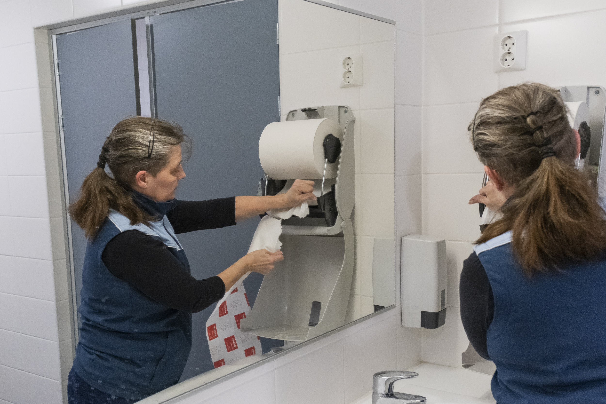 Shot for Oulun Ylioppilaslehti in January 2020. Pictured is a a clening lady in the campus bathroom of University of Oulu.